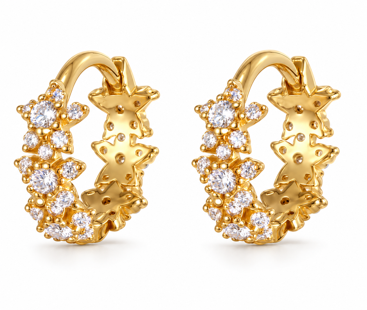 Pair of gold Allstar Huggie earrings on a white background