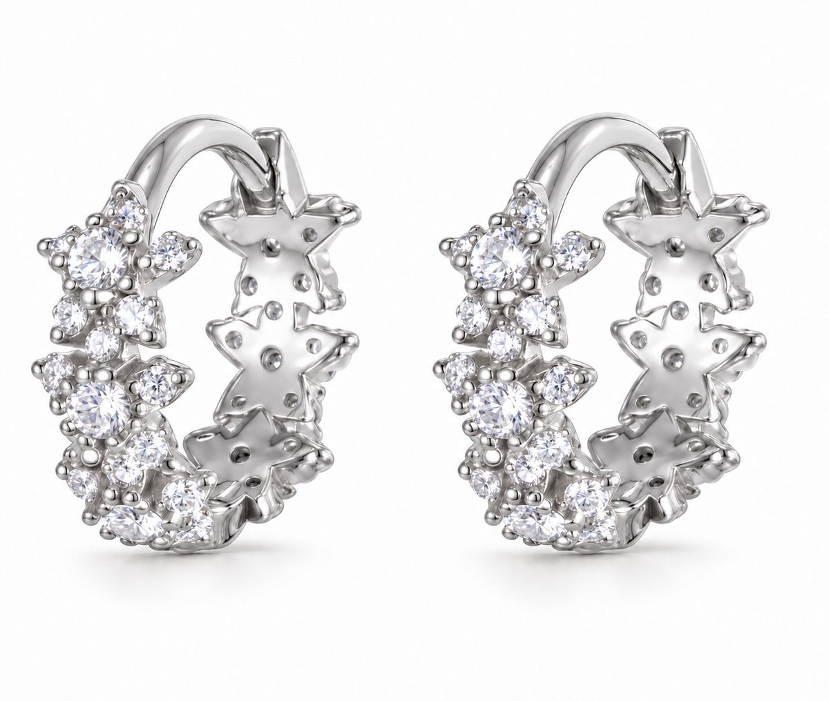 Pair of silver Allstar Huggie earrings on a white background