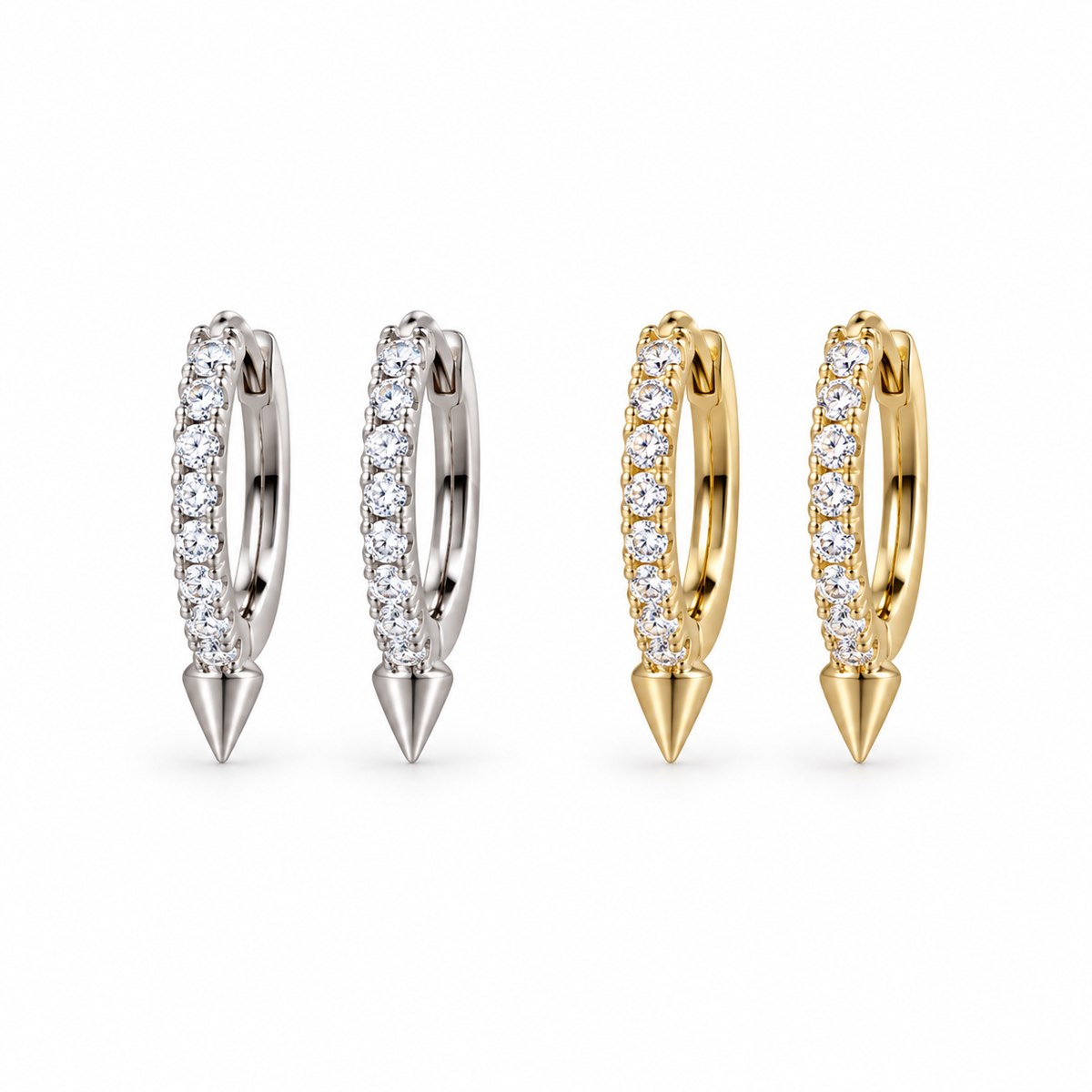 Diamond Spike huggie earrings in silver and gold on a white background