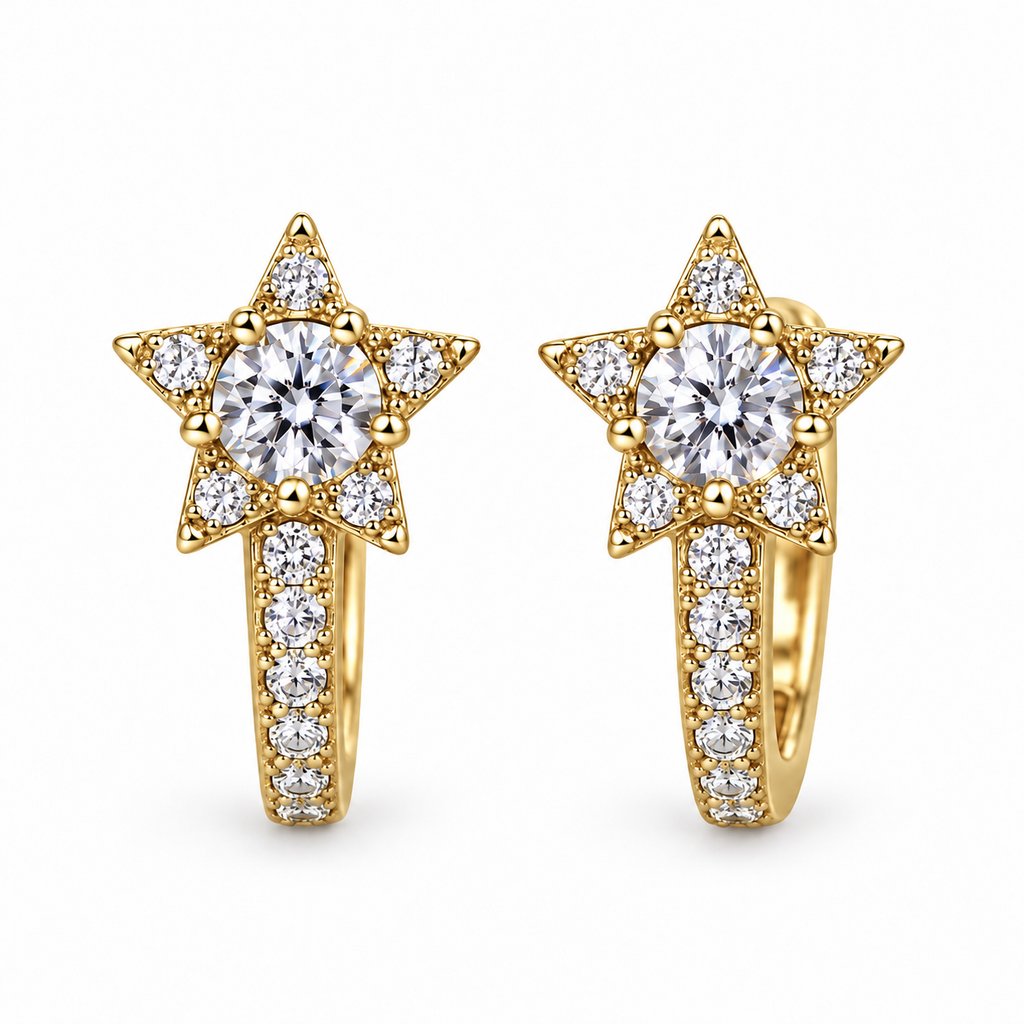 Pair of gold Starlight huggie earrings on a white background