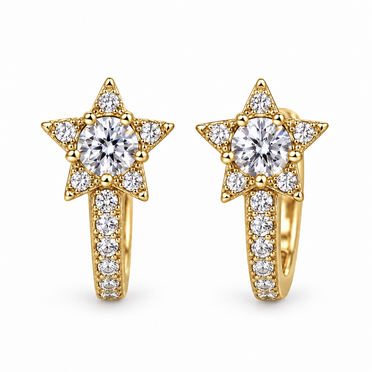 Pair of gold Starlight huggie earrings on a white background