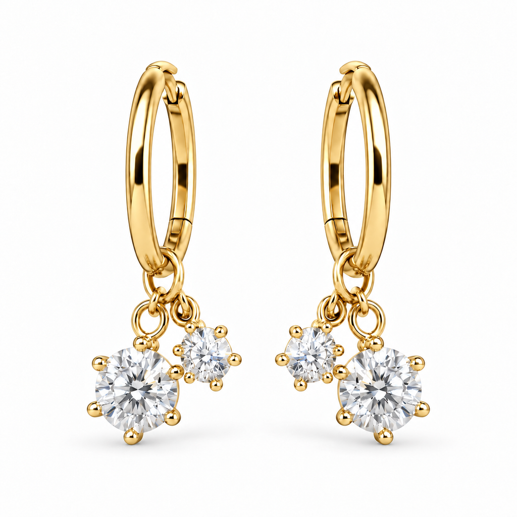 Pair of gold Sweetheart Huggie earrings on a white background
